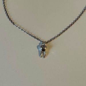 Goth silver tooth charms necklace.